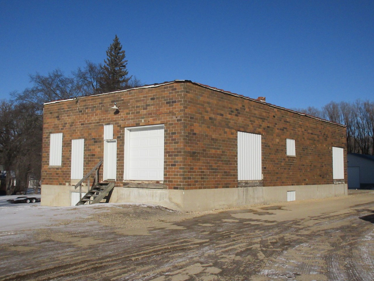 older building loading dock.  overhead door.  2 stories.