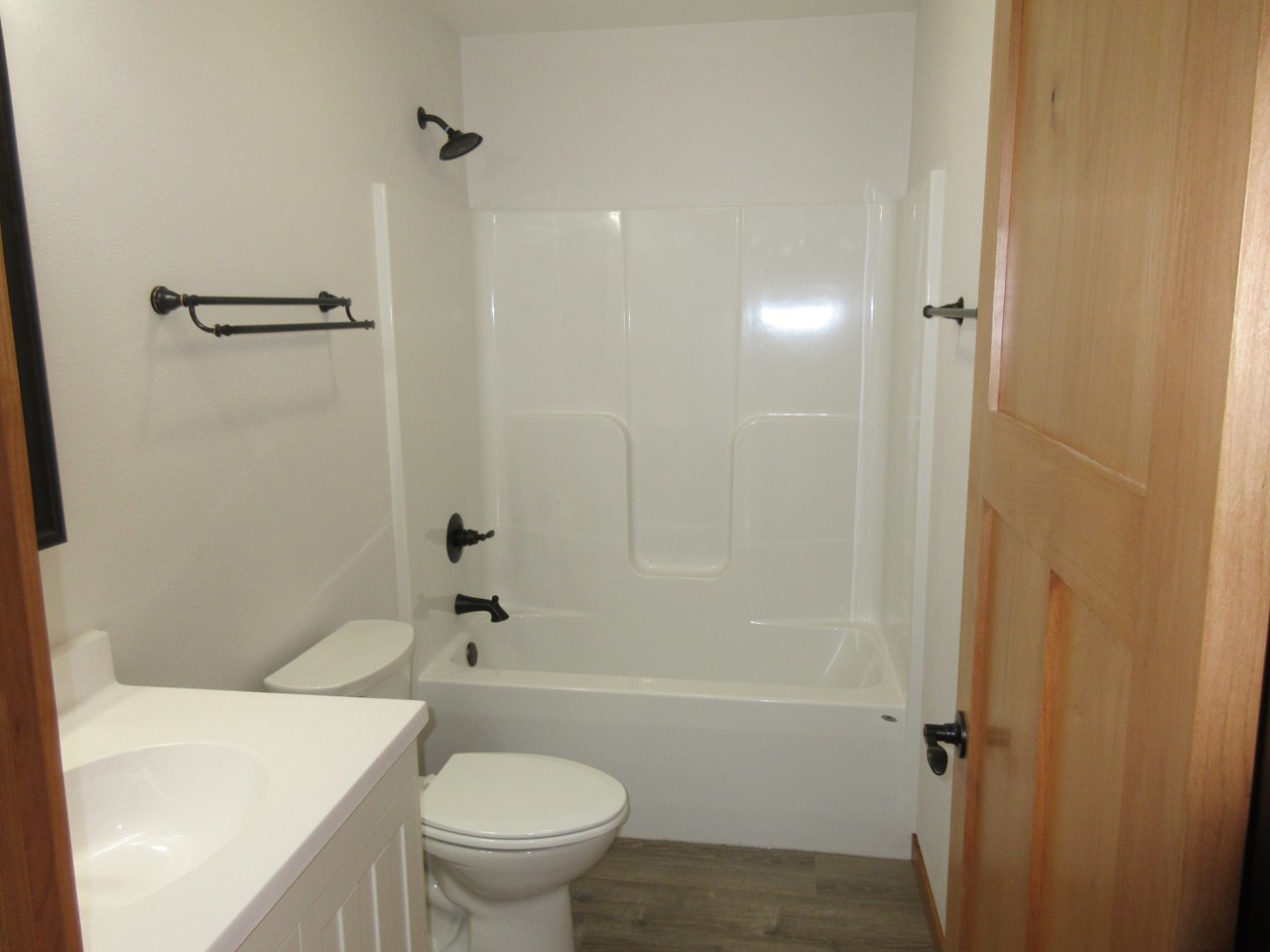 main bathroom tub and shower surround.