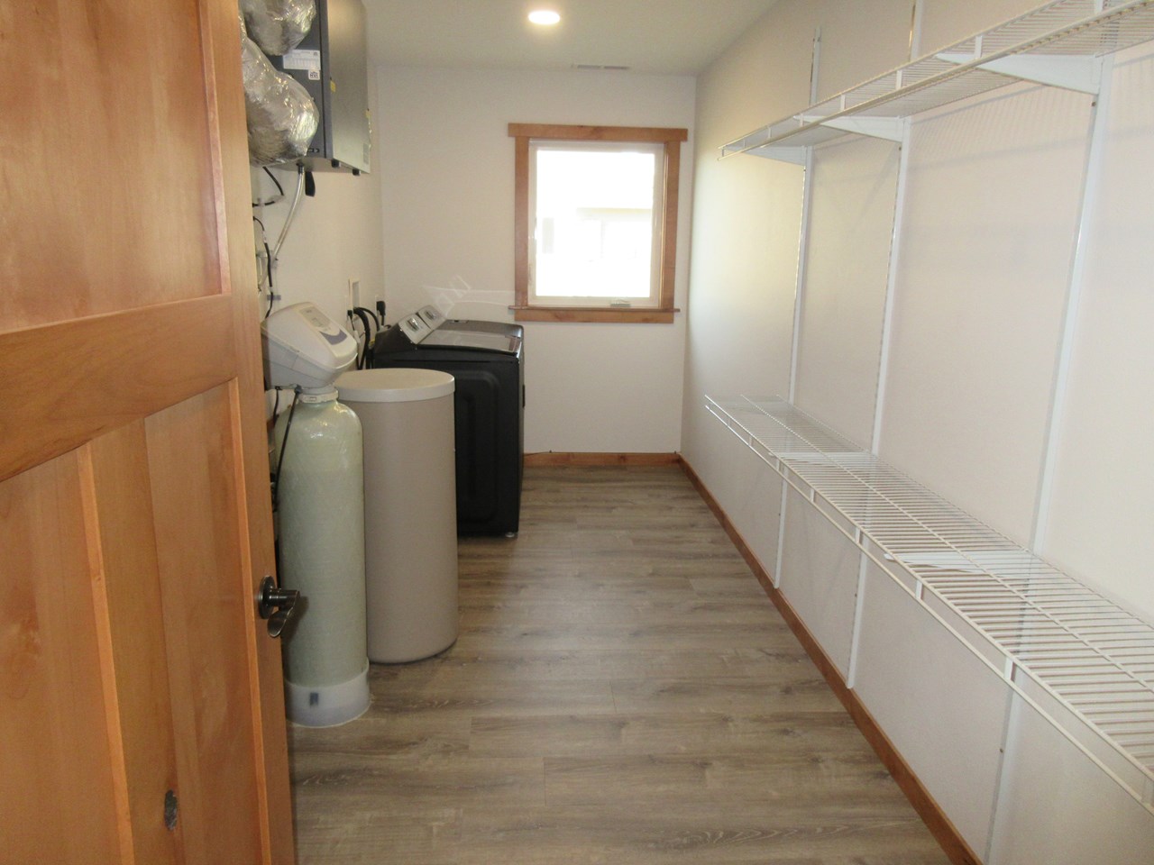 laundry and utility room with shelves