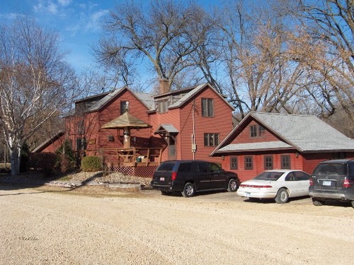 back of house. garage and plenty of gravel parking.