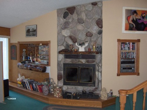 wood burning fireplace in living room.