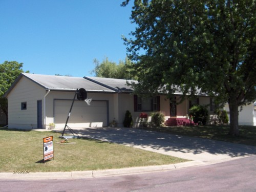 rambler style located in private neighborhood.