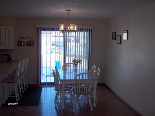 dining room. patio doors lead to patio and backyard.