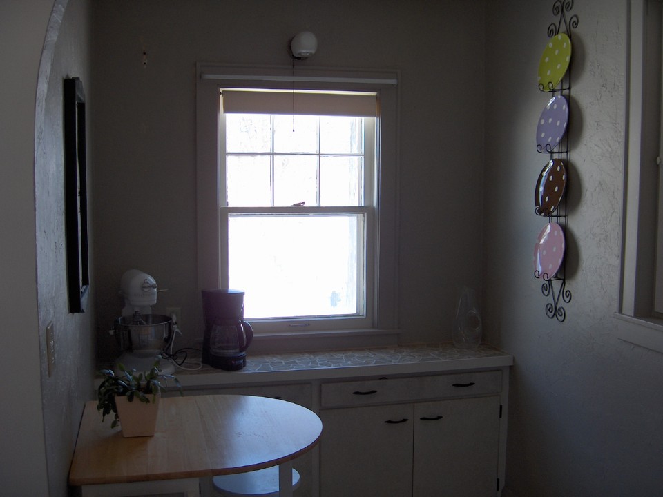 kitchen nook newly landscaped with gardens.