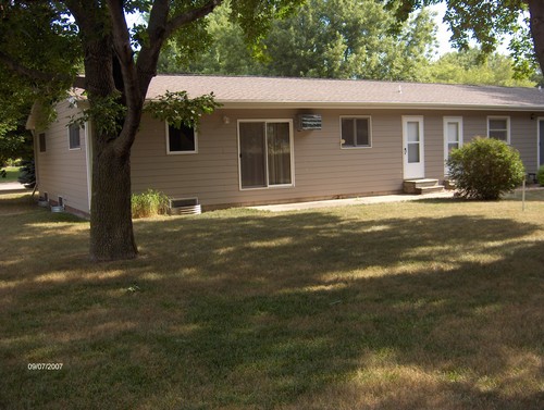 back of duplex has patio and back entrance